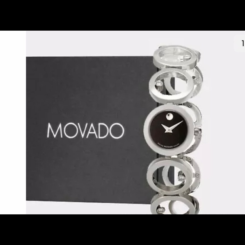 Sleek oldies MOVADO silver with 6- diamond accent watch.